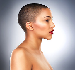 Image showing Woman, profile and beauty in studio for skincare, cosmetics and makeup on backdrop. Bald, female person and facial treatment and wellness by grey background for dermatology and lipstick for glow