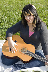 Image showing Girl Playing a Guitar