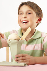 Image showing Smiling boy with an ice cream desert