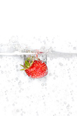 Image showing Strawberry Splashing Into Water