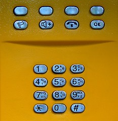 Image showing Public phone yellow keypad