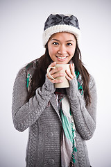 Image showing Beautiful asian woman drinking coffee