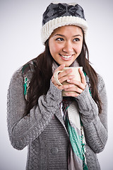 Image showing Beautiful asian woman drinking coffee