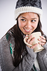 Image showing Beautiful asian woman drinking coffee