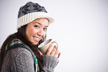 Image showing Beautiful asian woman drinking coffee