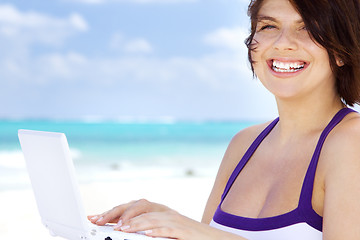 Image showing woman with laptop computer on the beach