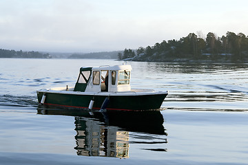 Image showing Motorboat on calm water