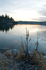 Image showing View over calm lake in sunset