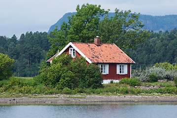 Image showing Small, red house by the sea