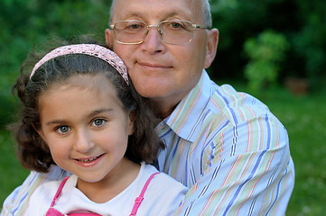 Image showing Happy grandfather and kid outdoors