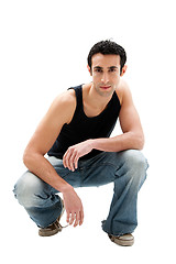 Image showing Handsome guy squatting