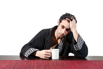 Image showing Guy with mug feeling bad