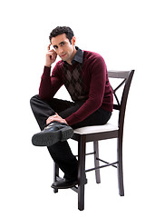 Image showing Handsome guy sitting on chair