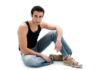 Image showing Handsome guy sitting on floor