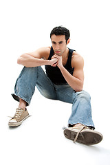 Image showing Handsome guy sitting on floor