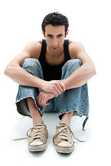 Image showing Handsome guy sitting on floor