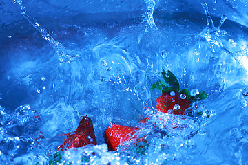 Image showing splashing strawberries