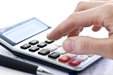 Image showing Tax calculator and pen