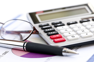 Image showing Tax calculator pen and glasses