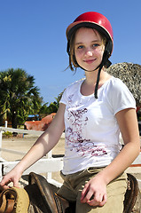 Image showing Girl riding horse