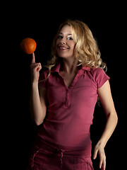 Image showing Teen beauty spinning orange