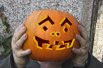 Image showing large pumpkin with painted face