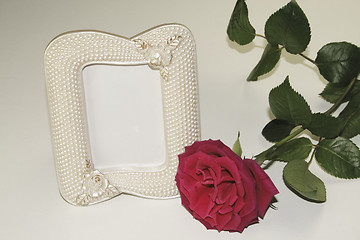 Image showing red rose and pearl picture frame