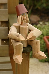 Image showing wooden log man