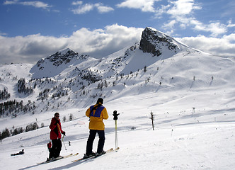 Image showing Skiing couple admiring the nature