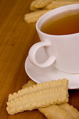 Image showing cup of tea and some cookies