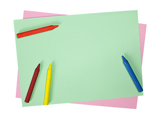 Image showing Crayons on colored papers