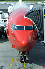 Image showing Red airplane at the gate