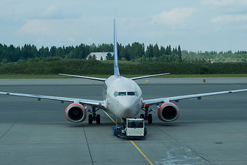 Image showing Passenger airplane being pushed back