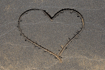 Image showing Heart drawing in black sand