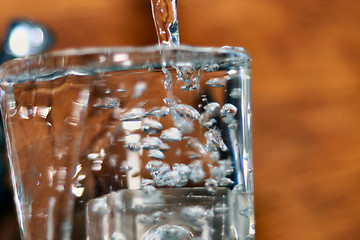 Image showing filling a glass of water