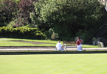 Image showing two workers painting a seat