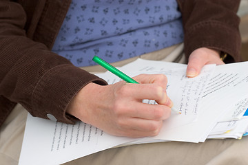 Image showing Woman Grading Papers