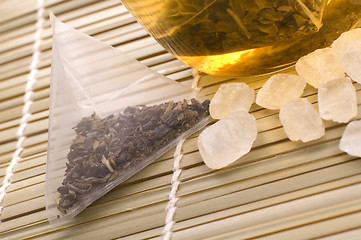 Image showing white tea, nylon tea-bag and sugar