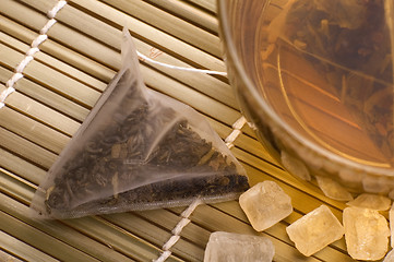 Image showing white tea, nylon tea-bag and sugar