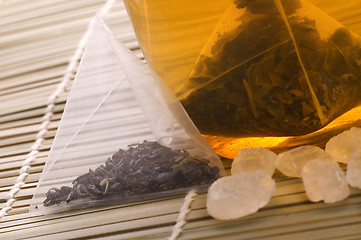 Image showing white tea, nylon tea-bag and sugar