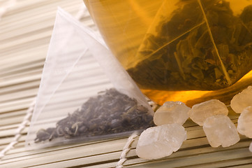 Image showing white tea, nylon tea-bag and sugar