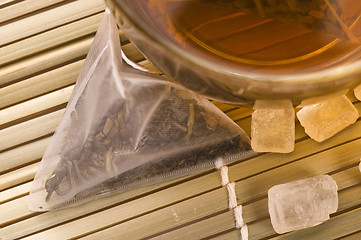 Image showing white tea, nylon tea-bag and sugar