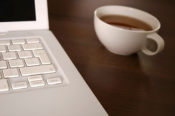 Image showing laptop and tea cup