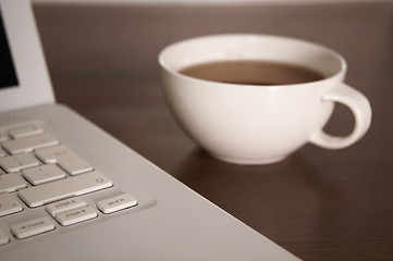 Image showing laptop and tea cup