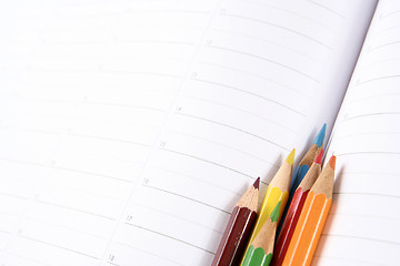 Image showing Color pencil and agenda