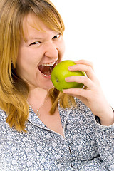 Image showing young woman eating apple