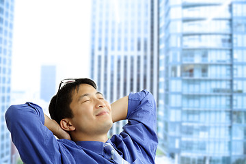 Image showing Asian businessman resting