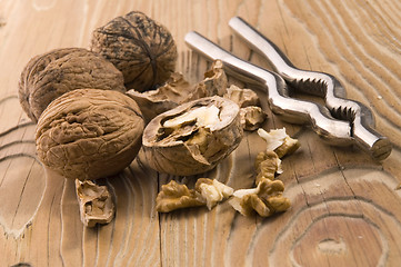 Image showing walnuts and nutcracker