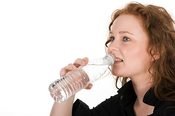 Image showing Young woman drinking mineral water 