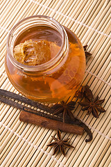 Image showing fresh honey with honeycomb and spices
